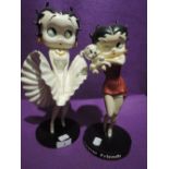 Two cartoon figures of Betty Boop including Marilyn Monroe style and party dress