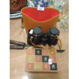 A pair of boots compact deluxe binoculars with case