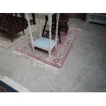 A Chinese pink fireside rug