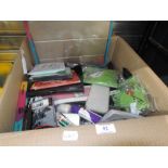 An assorted box of mixed shop stock including dvd's and electronic device accessories