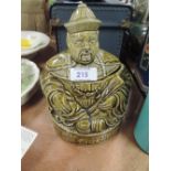 A ceramic tea jar with figural Chinese man design