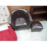 A childs size leatherette arm chair and foot stool