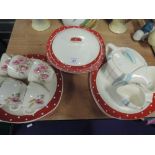 A selection of kitchen ware by Midwinter in a polka dot red and white spot design