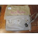 A beige leather Jane Shilton handbag , appears unused and in its dust cover .