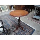 A Victorian style pedestal table