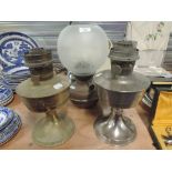 A selection of oil lamps with various designs including Aladdin