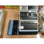 A Kodak EK6 polariod camera and Walkman style cassette player