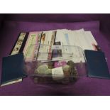 A selection of collectable coins and world currency including stamp first day selection