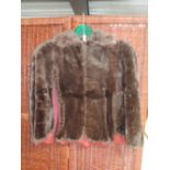 A vintage fur cape. Some damage to lining .