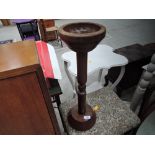 A turned wooden ashtray or key stand