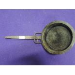 A sauce pan with wrought iron handle