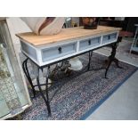 A modern wrought metal frame hall table