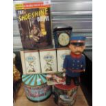 A selection of advertising tins and German style toy soldier figure