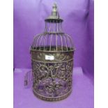 A decorative bird cage with gilt effect finnish