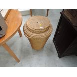 A wicker laundry basket and lamp