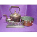 A copper stove kettle and similar copper cooking pot or pan