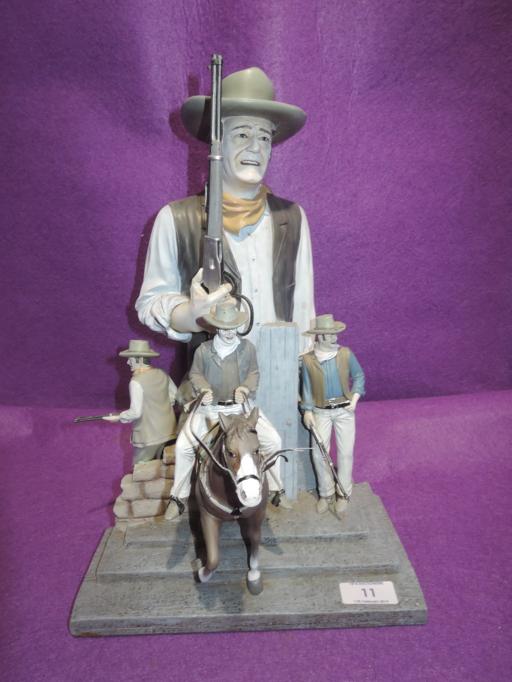 A diorama of John Wayne cow boy figures