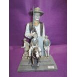 A diorama of John Wayne cow boy figures