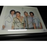 A framed photograph, Take That (4 piece), bearing signatures