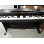 A Korg Concert C-303 digital piano