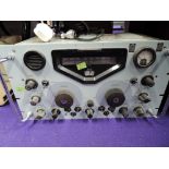 A vintage RACAL radio receiver Type No RA17, Military issue mark to dial