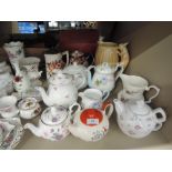 A selection of tea pots and milk jugs including Shelley