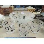 A selection of printed tumblers and fruit bowl