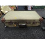 A suitcase with leather and canvas body marked E Smith