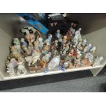 A selection of figures and figurines including Beatrix potter