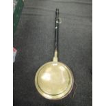 A copper and brass bodied bed warming pan