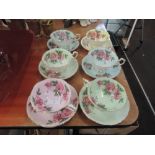 A set of six harlequin tea cups and saucers by Paragon