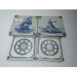 A selection of vintage tiles including hand painted blue and white delft