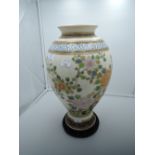 An oriental Chinese style vase bearing mark to base with enamel bird of paradise decoration