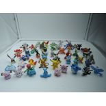 A selection of Pokemon figures and similar some marked Nintendo Tomy