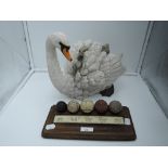 A figurine by Country artist's hand decorated Swan and signets and the development of the Golf ball