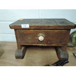 A small hand made foot stool or shelf set with integral drawer