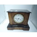 A veneer fronted mantle clock with an American style design