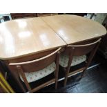 A vintage oval dining table and set of 6 (4 plus 2) chairs