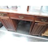 A late Victorian mahogany pedestal desk