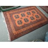 A vintage Eastern style rug having russet ground