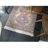 A vintage fireside rug having pink ground