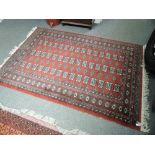 A vintage Eastern style rug having burgundy ground