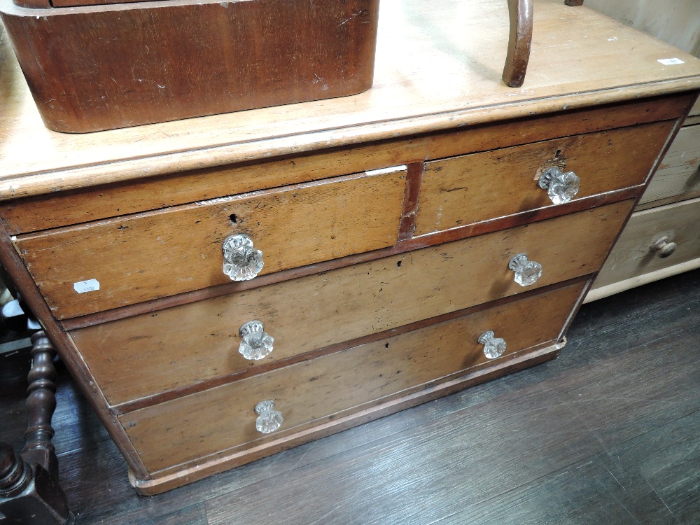 A stripped pine chest of two over two drawers