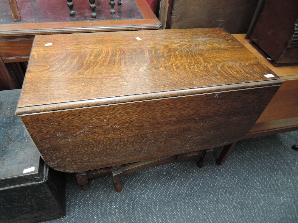 An early to mid 20th Century oak twist gate leg dining table