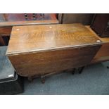 An early to mid 20th Century oak twist gate leg dining table