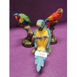 A selection of parrot figures and figurines