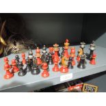 A set of painted wooden chess pieces