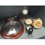 A selection of clocks, a barometer and compass