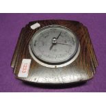 A barometer by Smiths compensated with oak body