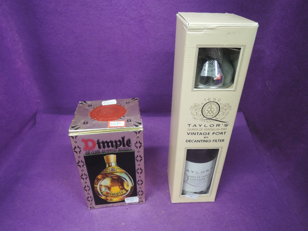 A bottle of Taylors Quinta De Vargellas 1982 vintage port with decanting filter in box and a